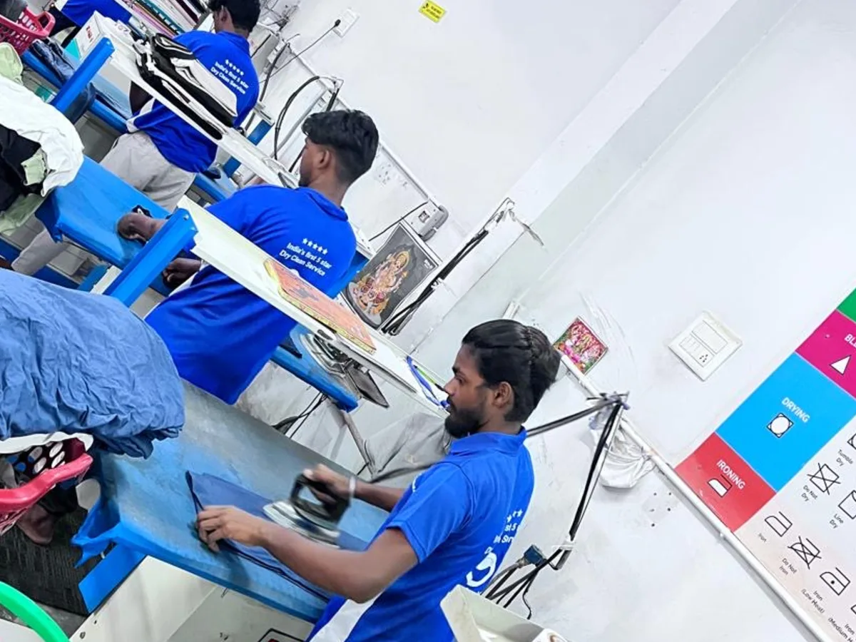 The LaundroKart team finishing garments