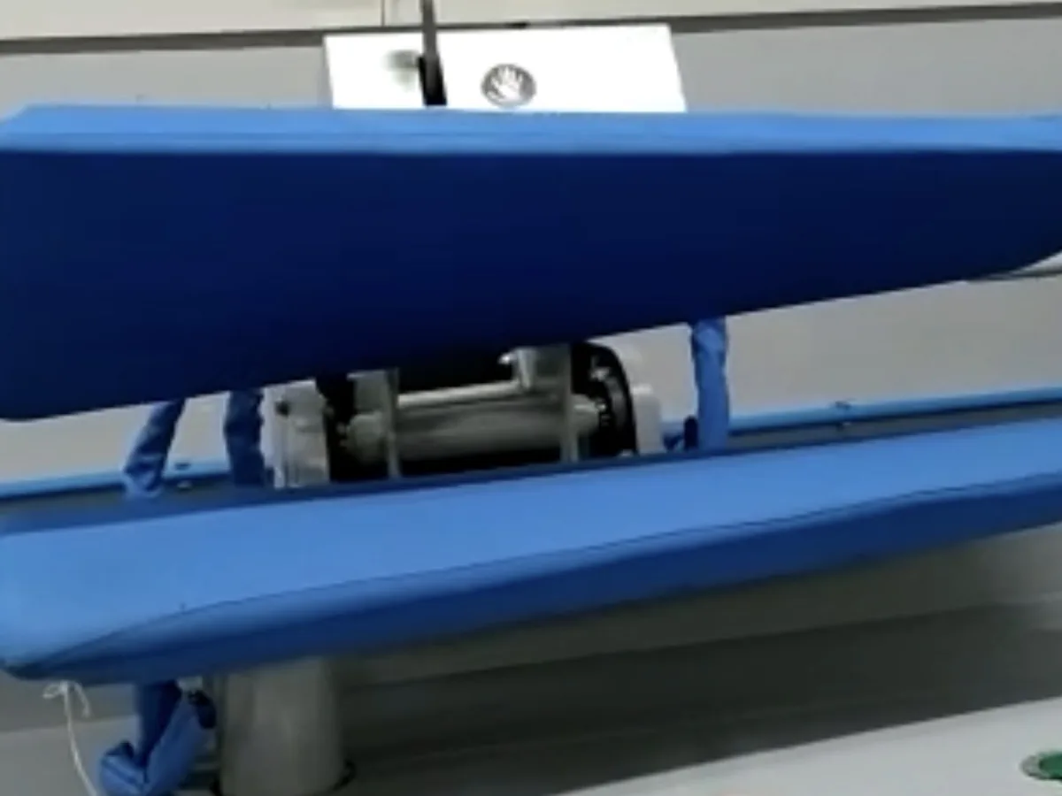 A steam press at the LaundroKart factory